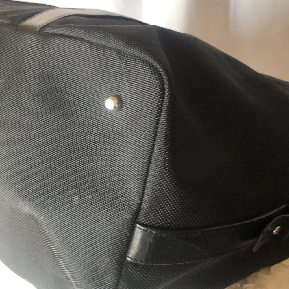 TUMI black Boston 2 way leather and canvas and mini lock. Detachable straps.